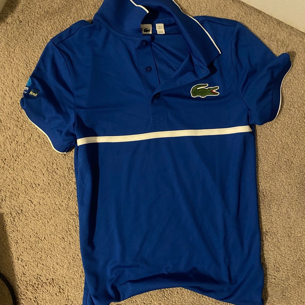 Blue Lacoste t shirt size extra small -small